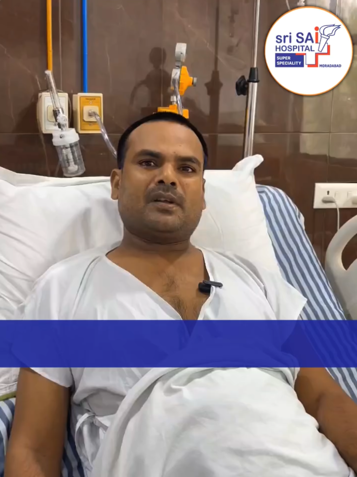 Patient recovering in a hospital bed after revision hip replacement