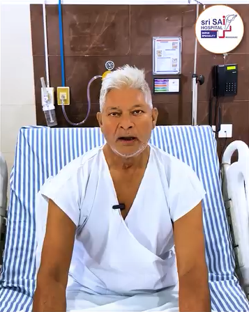 Mr. Satyapal recovering in a hospital bed after knee replacement