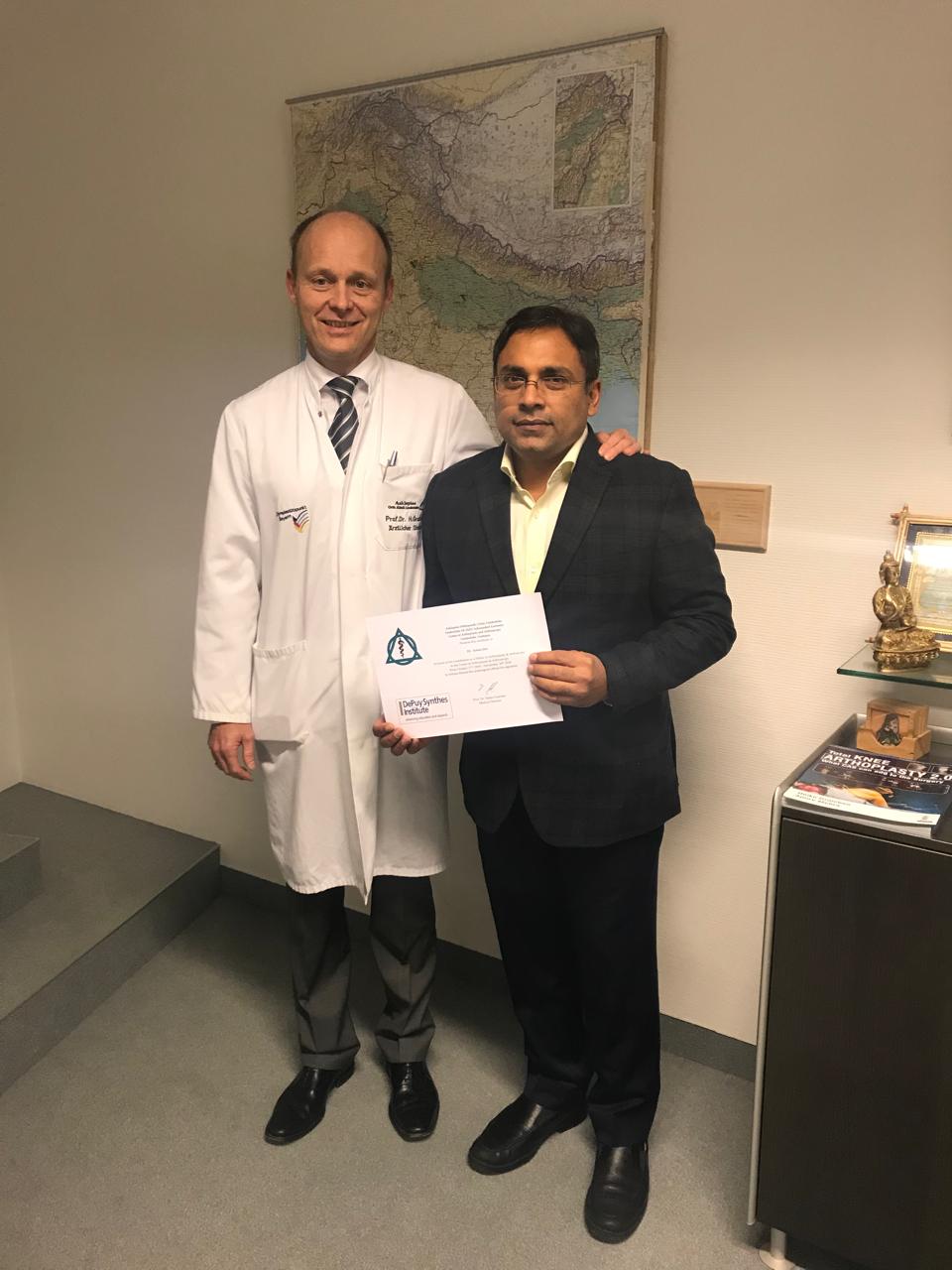 Dr. Ankur Goel receiving his orthopedic qualification certificate